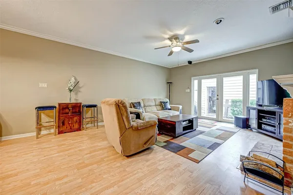 a living room with fireplace furniture and a flat screen tv