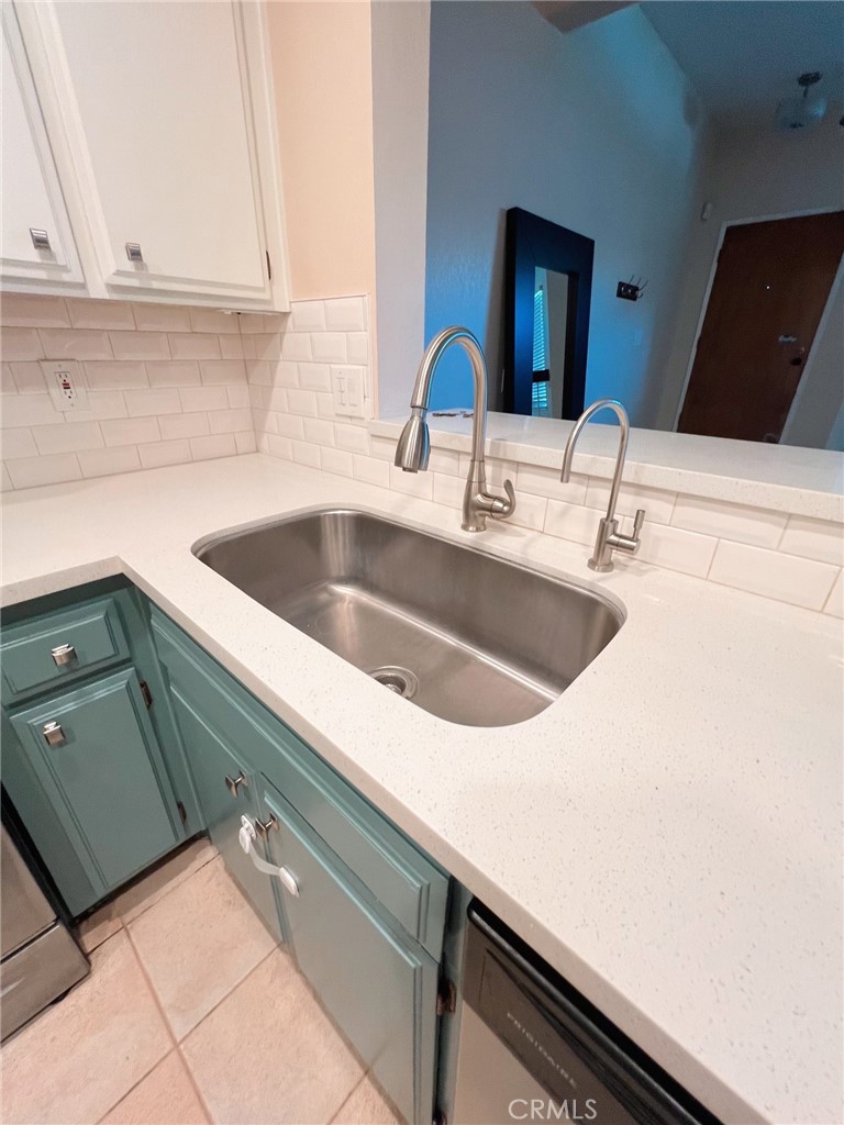 47 Brownfield Lane Phillips Ranch, CA 91766 - Photo 4 of 10 a kitchen with a sink and a stove top oven