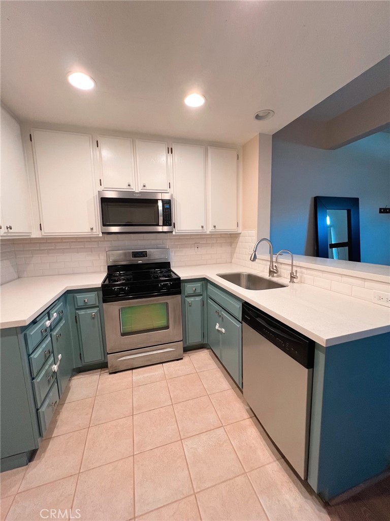 47 Brownfield Lane Phillips Ranch, CA 91766 - Photo 5 of 10 a kitchen with a sink and cabinets