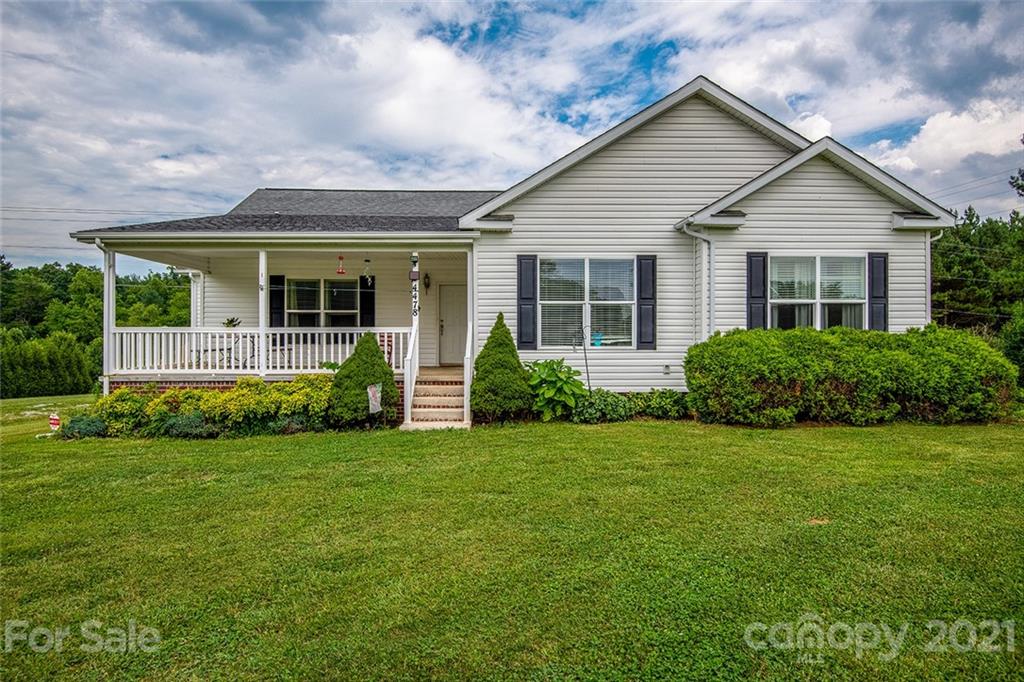 4478 Hickory Nut Ridge Road Hudson, NC 28638 - Photo 1 of 29 a view of a house with a yard