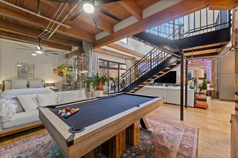 a view of an entryway and livingroom with furniture