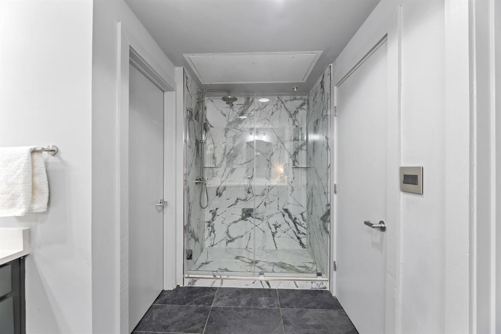 509 Elm Street, Unit 601 Dallas, TX 75202 - Photo 23 of 37 a view of a bathroom with shower