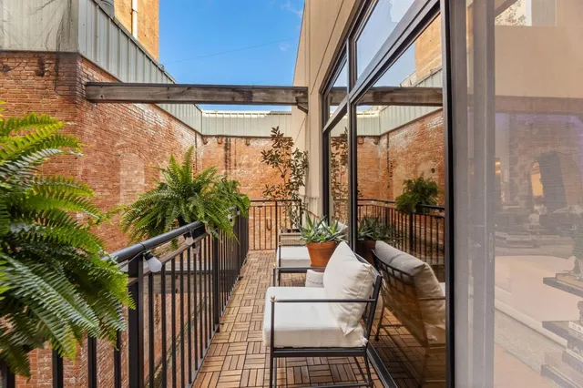 a view of balcony with furniture