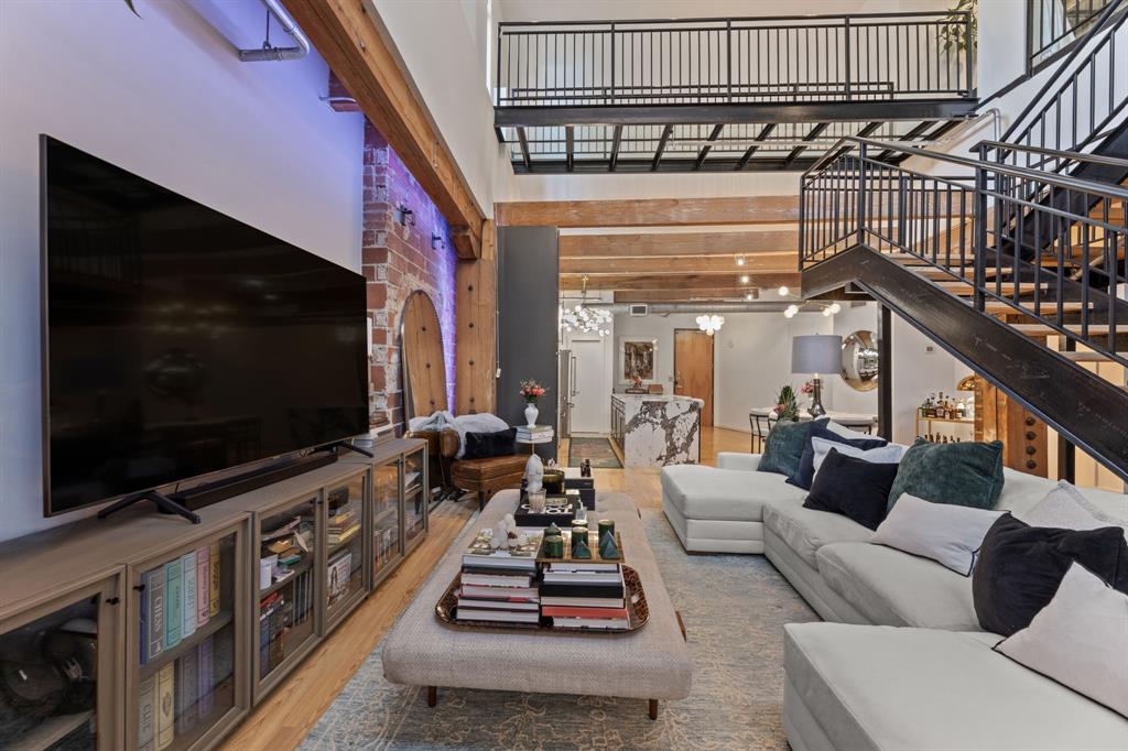 509 Elm Street, Unit 601 Dallas, TX 75202 - Photo 3 of 37 a living room with furniture and a flat screen tv