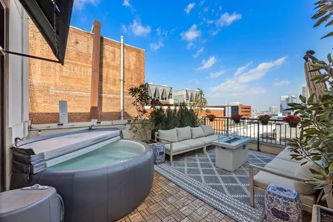 a outdoor living space with furniture and city view