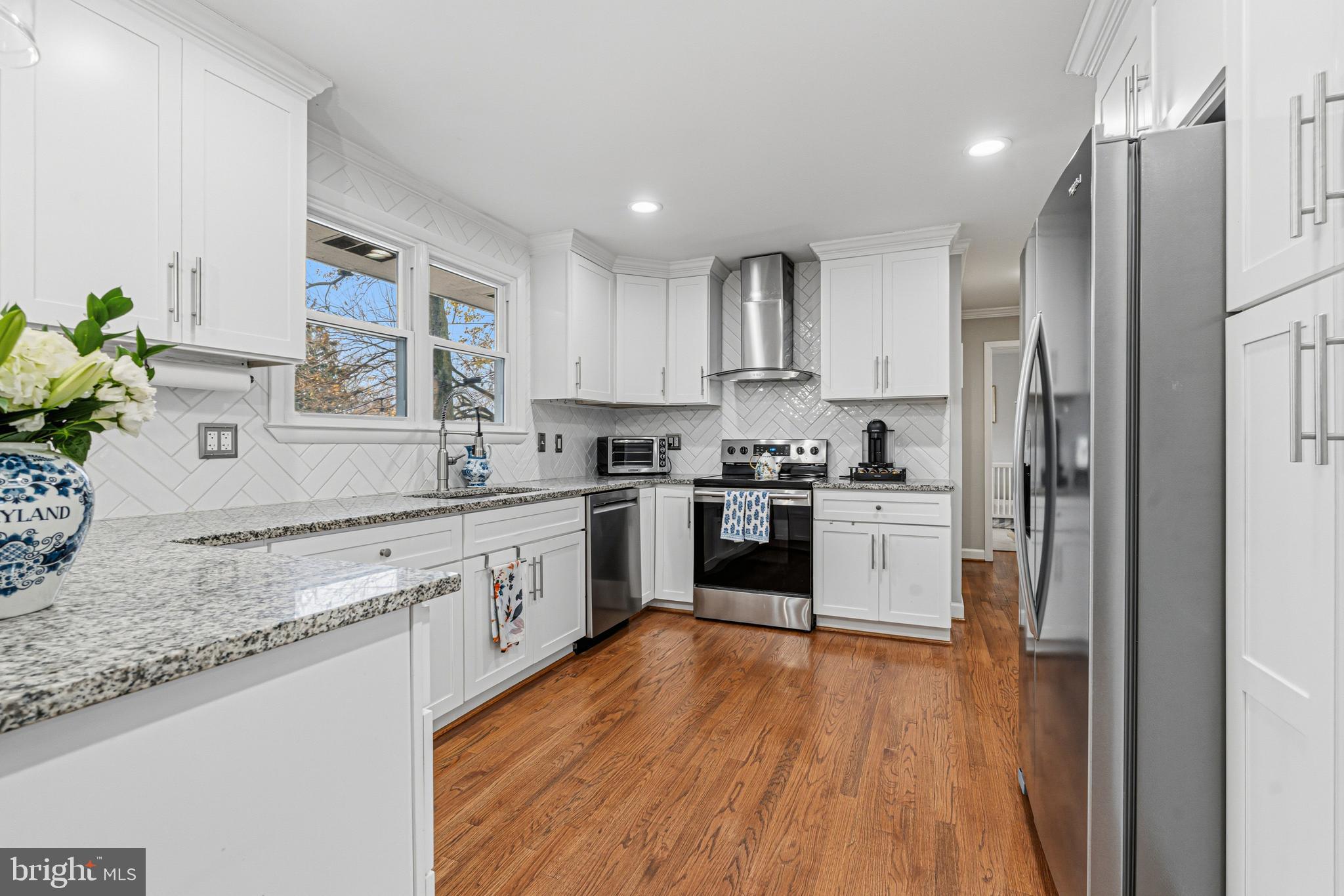 231 East Timonium Road Lutherville-Timonium, MD 21093 - Photo 25 of 66 a kitchen with stainless steel appliances granite countertop a refrigerator sink and white cabinets
