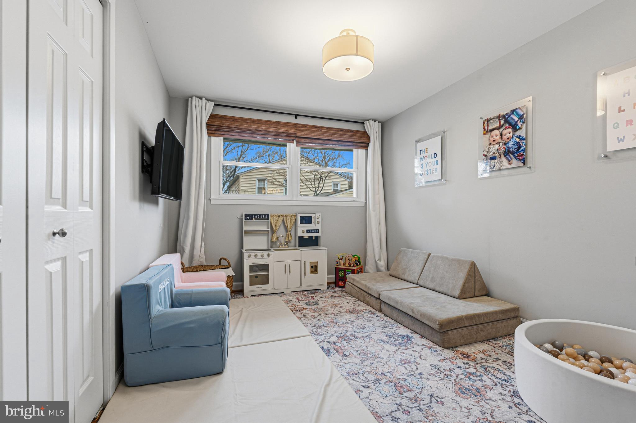 231 East Timonium Road Lutherville-Timonium, MD 21093 - Photo 35 of 66 a living room with furniture and a flat screen tv