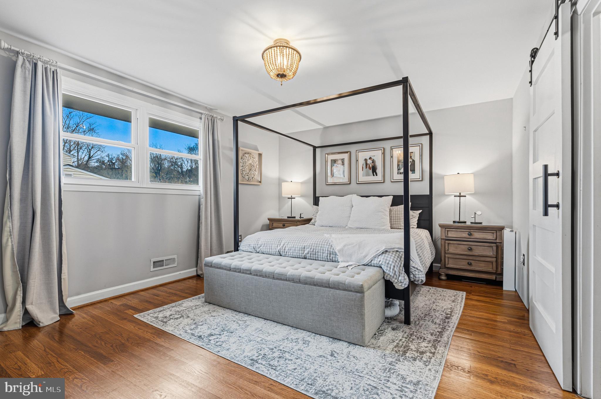 231 East Timonium Road Lutherville-Timonium, MD 21093 - Photo 37 of 66 a bedroom with a large bed and wooden floor