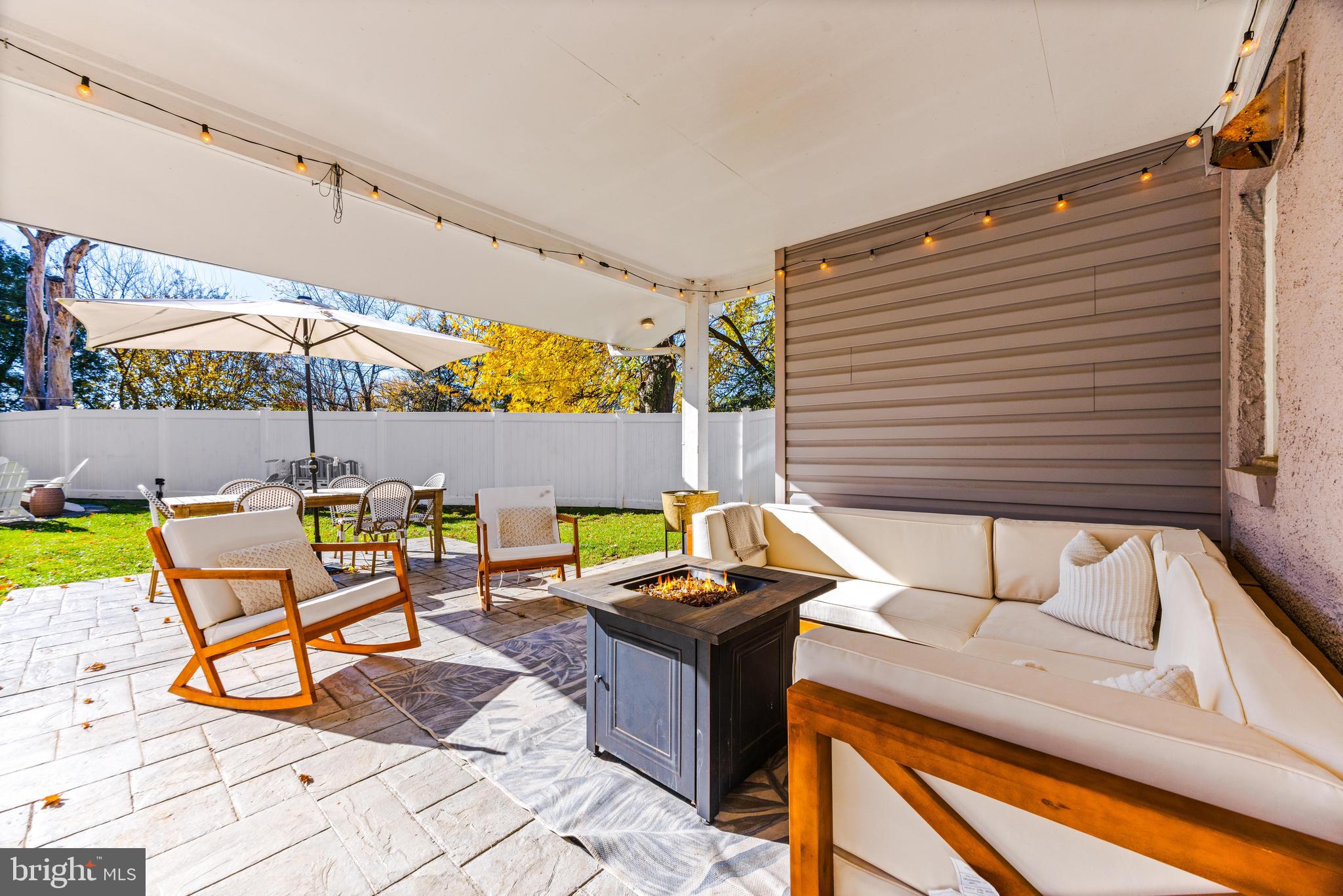 231 East Timonium Road Lutherville-Timonium, MD 21093 - Photo 57 of 66 a backyard of a house with barbeque oven table and chairs
