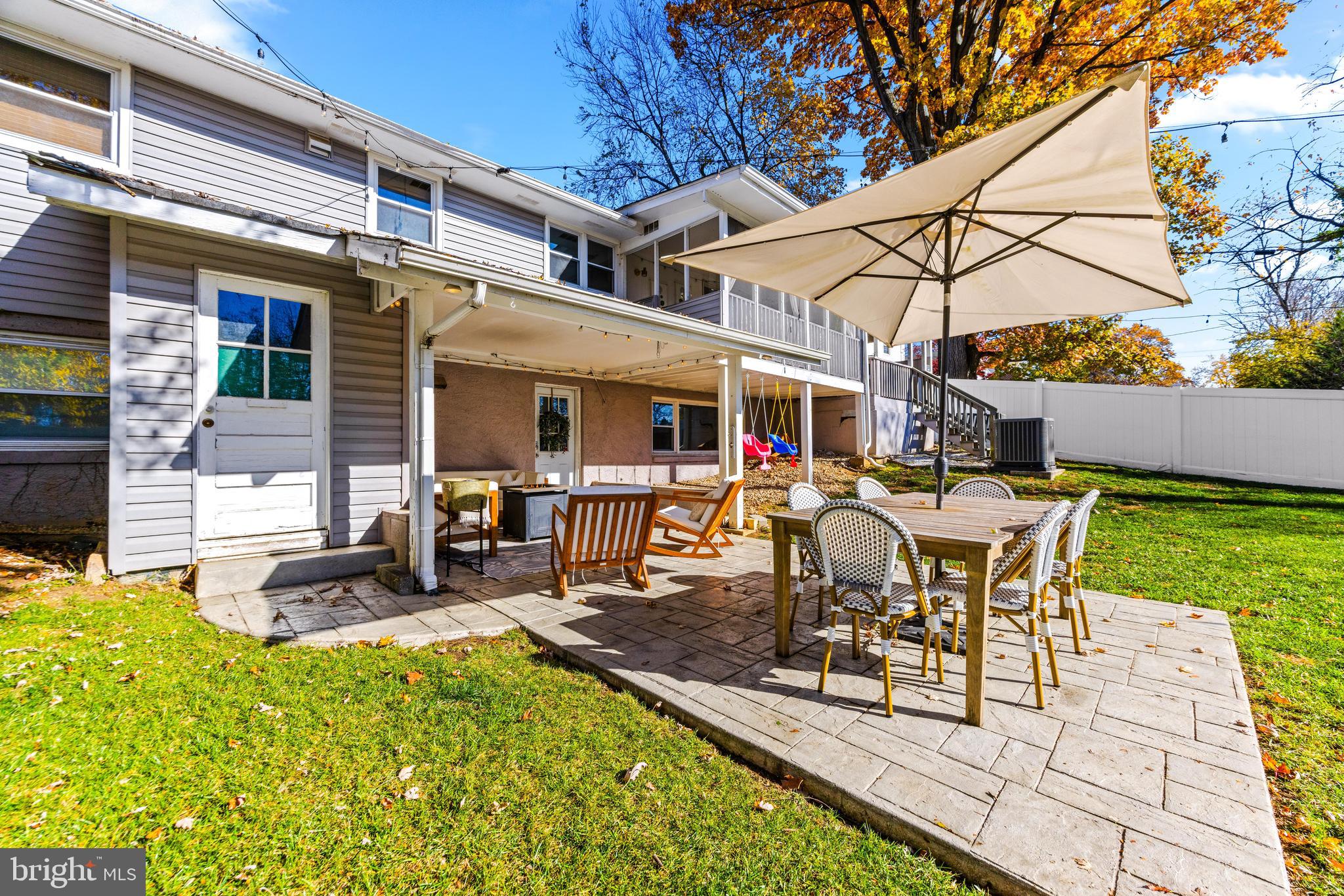 231 East Timonium Road Lutherville-Timonium, MD 21093 - Photo 59 of 66 a view of a patio with table and chairs under an umbrella