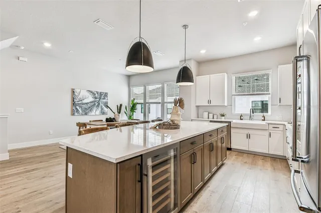a kitchen with a counter space cabinets and appliances