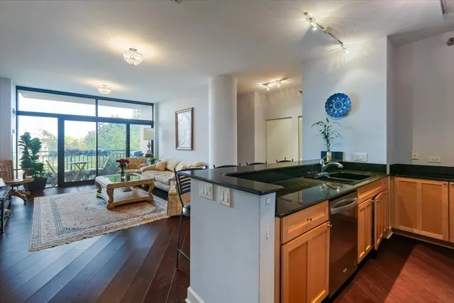 a kitchen with stainless steel appliances granite countertop a stove and a sink