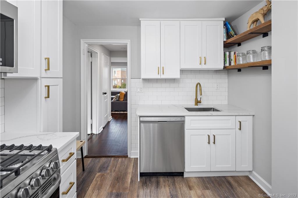 21 Standish Road, Unit 10D1 Stamford, CT 06902 - Photo 1 of 1 Brand new high-end kitchen with custom cabinets, stainless steel appliances, luxurious bronze fixtures and and bespoke shelving