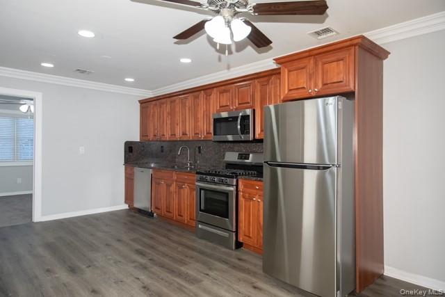 311 West Main Street, Unit 12 Patchogue, NY 11772 - Photo 3 of 8 a kitchen with stainless steel appliances a refrigerator sink and microwave