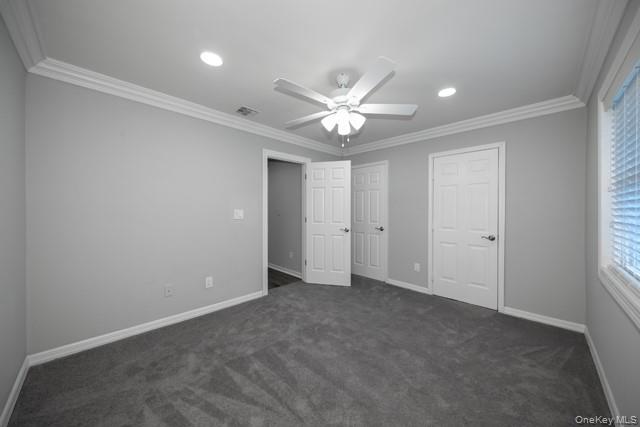 311 West Main Street, Unit 12 Patchogue, NY 11772 - Photo 7 of 8 an empty room with a ceiling fan and a window