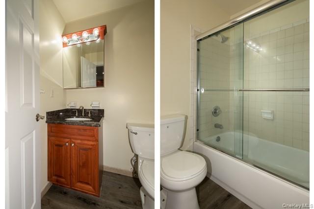 311 West Main Street, Unit 12 Patchogue, NY 11772 - Photo 8 of 8 a bathroom with a granite countertop toilet sink and shower