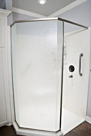 a bathroom with a glass shower door