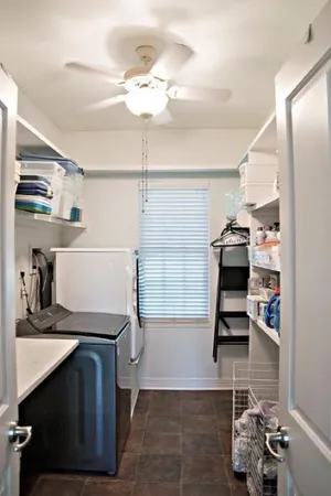 a front view of a house with outdoor seating