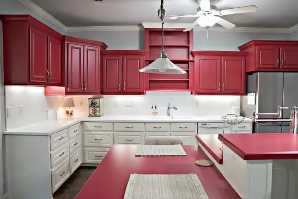 a kitchen with stainless steel appliances granite countertop a sink dishwasher stove and cabinets with wooden floor