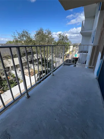 a view of balcony with furniture and stairs