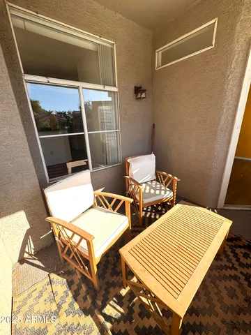 a view of a hardwood floor and staircase