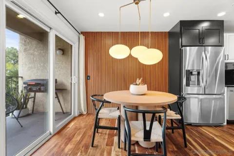 a kitchen with stainless steel appliances a refrigerator sink and microwave