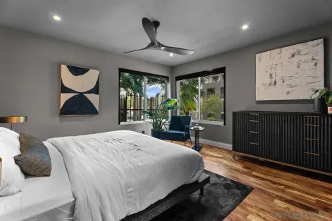a living room with furniture and a floor to ceiling window