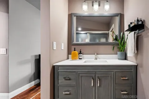 a bathroom with a glass shower door