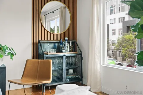 a dining room with furniture and a window