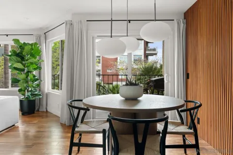 a view of a dining room with furniture window and wooden floor