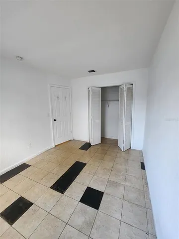 a view of a livingroom with a dishwasher and cabinets