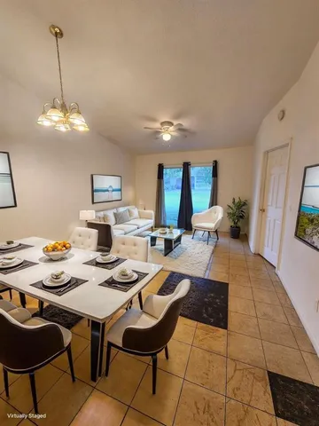 a very nice looking dining room with a table and chairs