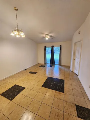a view of a livingroom with a dinning table and chair