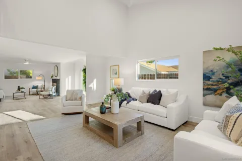 a living room with furniture and white walls
