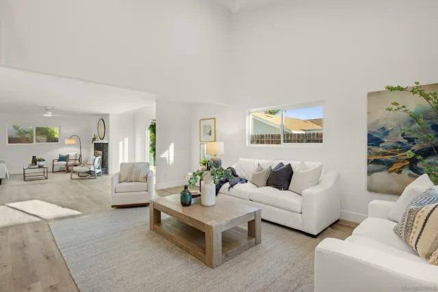 a living room with furniture and white walls