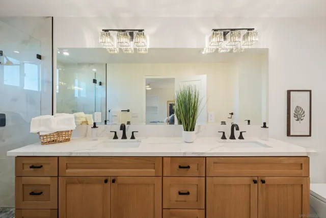 a bathroom with a sink double vanity and a mirror