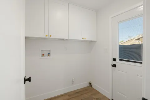 a view of cabinets and wooden floor