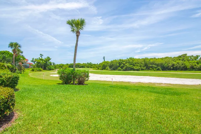 a view of lake with green space