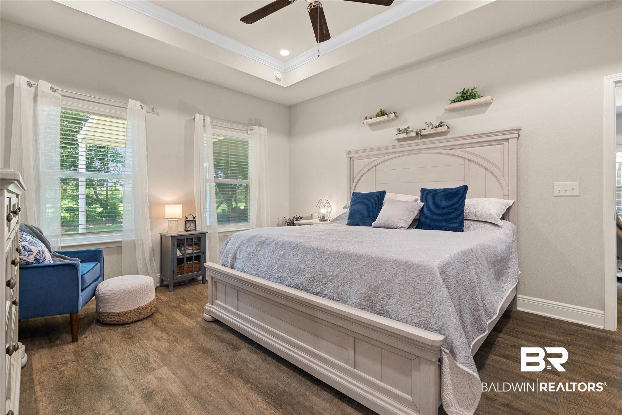 9037 Impala Drive Foley, AL 36535 - Photo 7 of 21 Bedroom featuring ornamental molding, wood finished floors, ceiling fan, and a raised ceiling