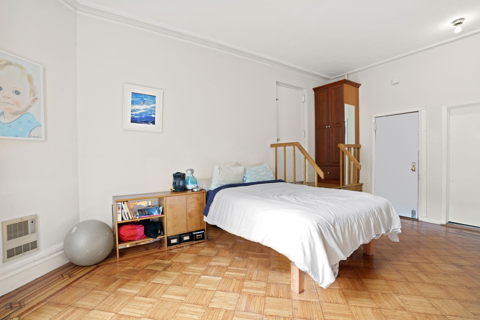 142 East 37th Street, Unit 3 Manhattan, NY 10016 - Photo 6 of 10 a bedroom with a bed and a table