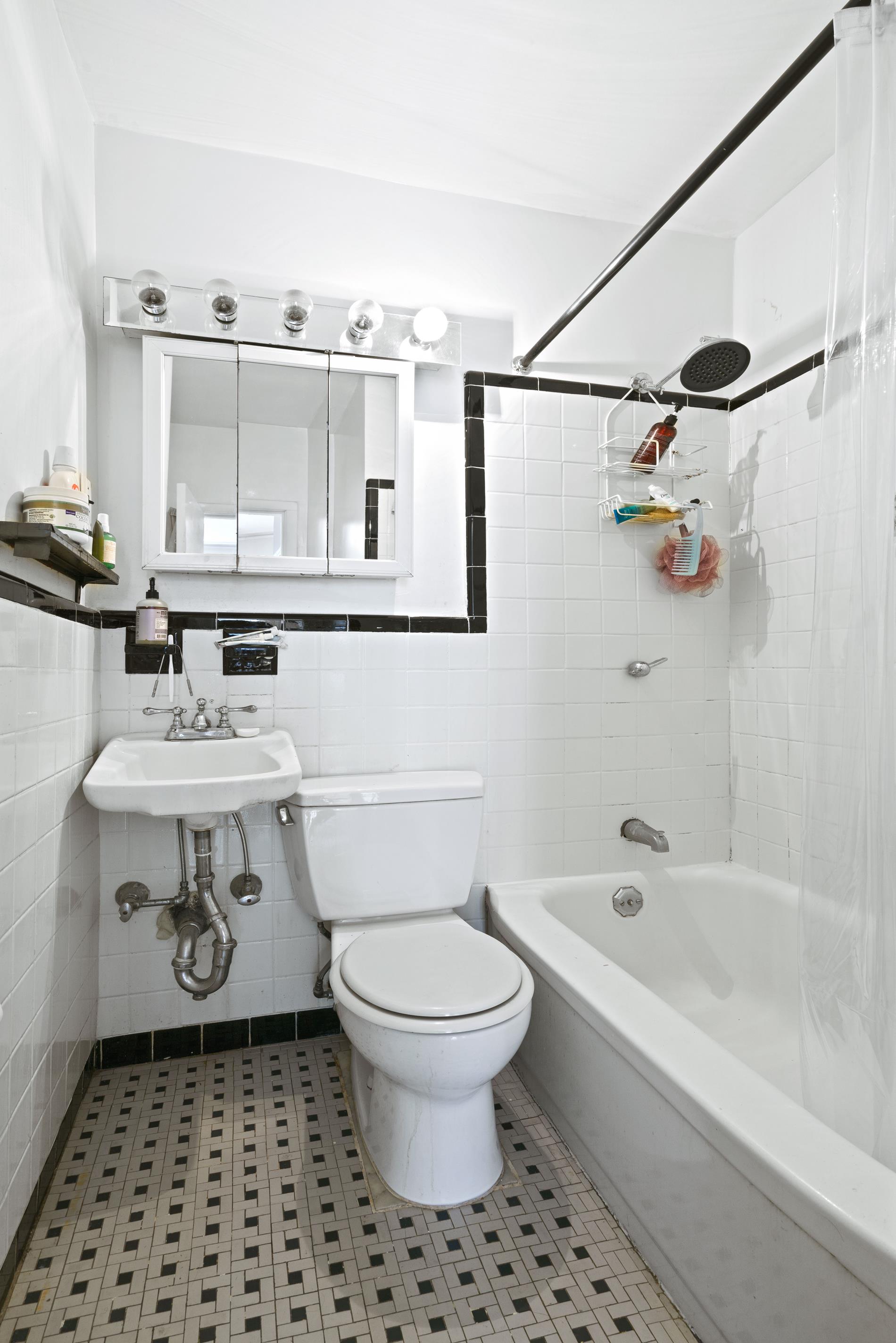 142 East 37th Street, Unit 3 Manhattan, NY 10016 - Photo 8 of 10 a bathroom with a sink a toilet and a bathtub