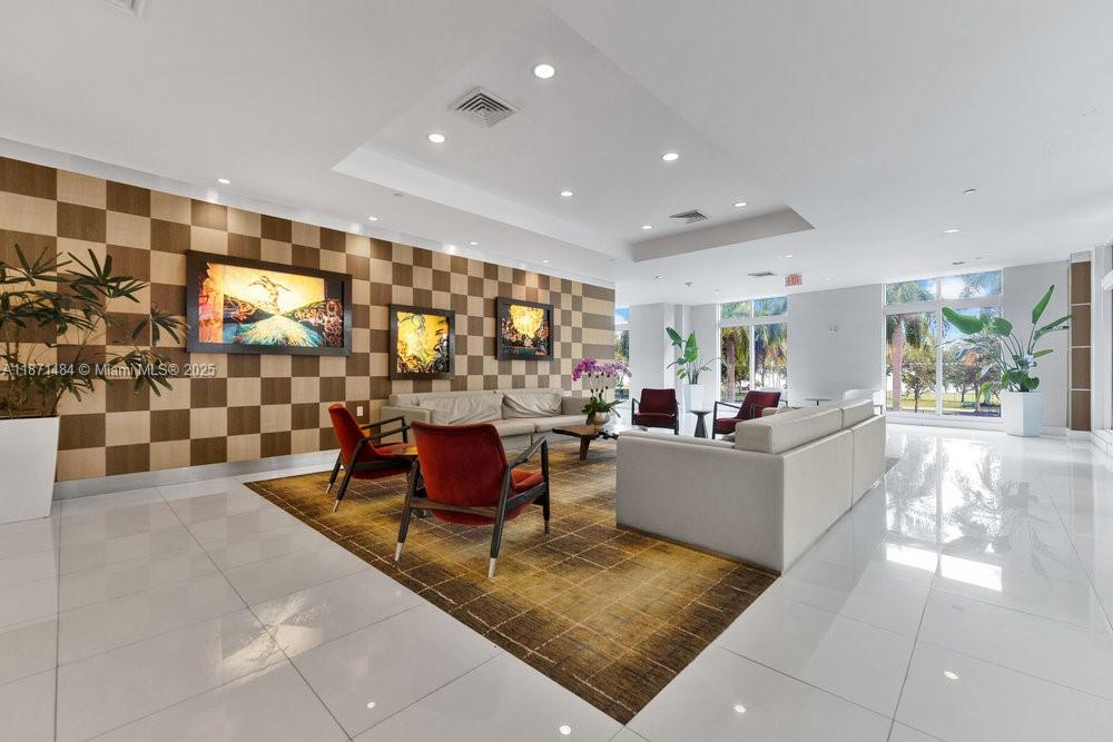 1800 North Bayshore Drive, Unit 614 Miami, FL 33132 - Photo 20 of 29 a living room with furniture and a large window