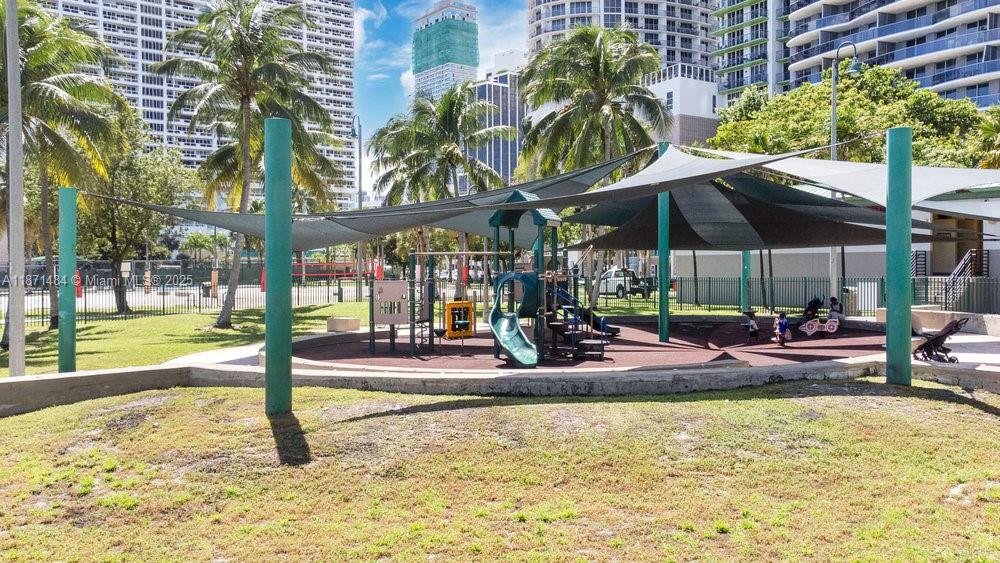 1800 North Bayshore Drive, Unit 614 Miami, FL 33132 - Photo 28 of 29 a view of a swimming pool with a patio