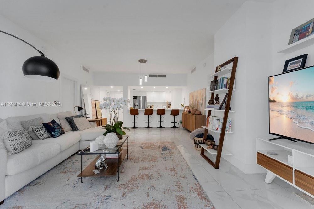 1800 North Bayshore Drive, Unit 614 Miami, FL 33132 - Photo 7 of 29 a living room with furniture and a flat screen tv