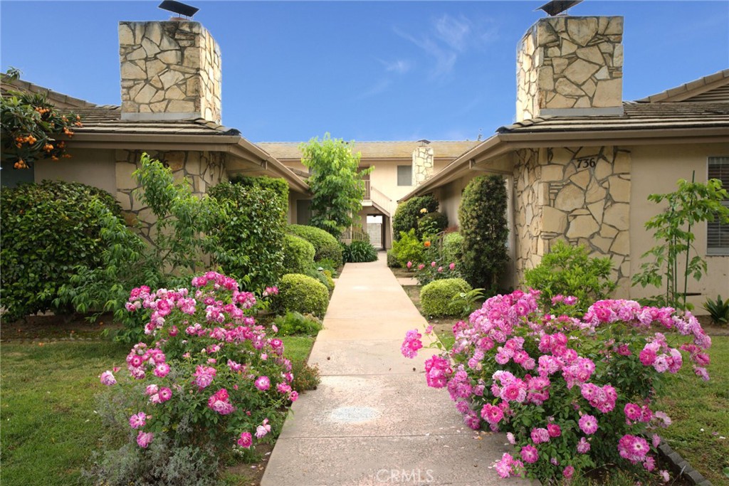 736 Southview Road, Unit E Arcadia, CA 91007 - Photo 1 of 1 a pink flowers in front of the house