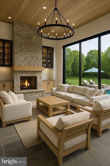 11313 Marcliff Road North Bethesda, MD 20852 - Photo 3 of 22 a living room with furniture large windows and a fireplace