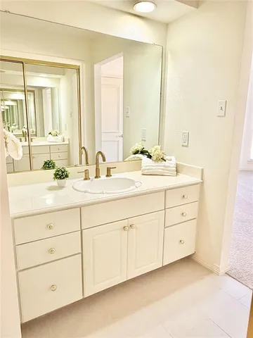a bathroom with double sink and a mirror