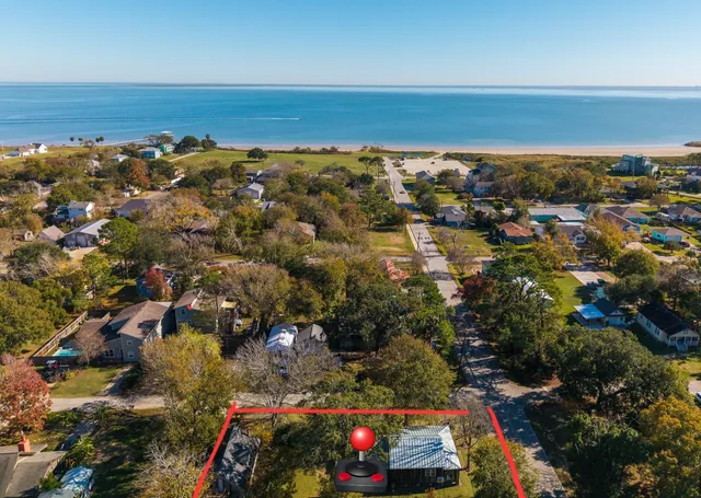a view of a swimming pool with an outdoor seating and yard