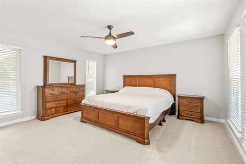 a bedroom with a bed and a cabinets
