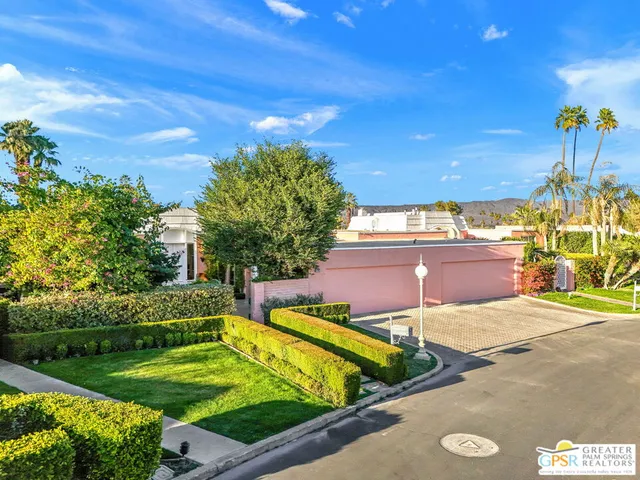 a view of a golf course with chairs